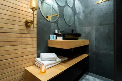 a bathroom with a sink and a mirror at charcho place in Les Camps