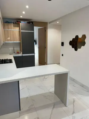 a kitchen with a white counter top in a room at Casawi in Casablanca