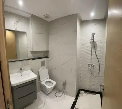 a bathroom with a shower and a toilet and a sink at Casawi in Casablanca