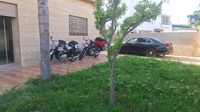 a couple of motorcycles parked next to a building at Suites au sein d'une Villa au centre ville de Rabat in Rabat