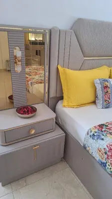 a bedroom with a bed and a mirror at Suites au sein d'une Villa au centre ville de Rabat in Rabat