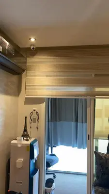 a room with a bed and a desk and a window at Appartement Prestige à Rabat Océan - 2min de la Plage in Rabat