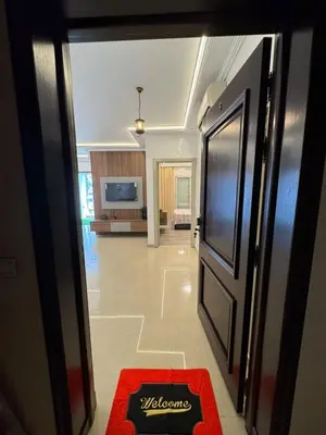 a hallway with a door and a red rug at BellaVita in Casablanca