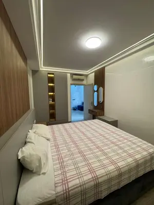 a bedroom with a large bed with a striped blanket at BellaVita in Casablanca