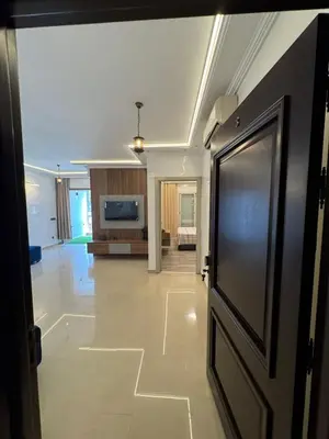 a hallway with a door and a living room at BellaVita in Casablanca