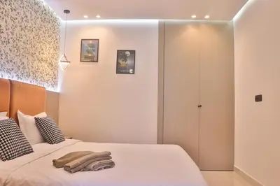 a bedroom with a bed with two towels on it at Studio Luxe avec Vue sur la Corniche in Casablanca