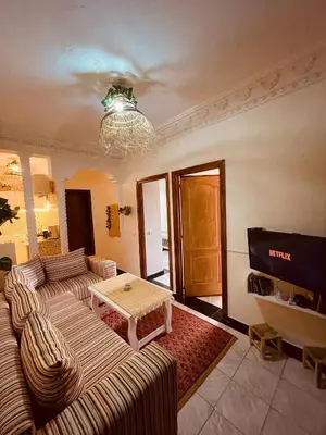 a living room with two couches and a television at Beautiful Studio in Casablanca in Casablanca