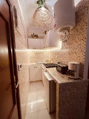 a small kitchen with a sink and a stove at Beautiful Studio in Casablanca in Casablanca