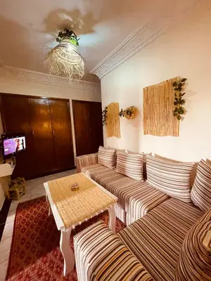 a living room with a couch and a table at Beautiful Studio in Casablanca in Casablanca