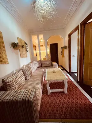 a living room with a couch and a coffee table at Beautiful Studio in Casablanca in Casablanca