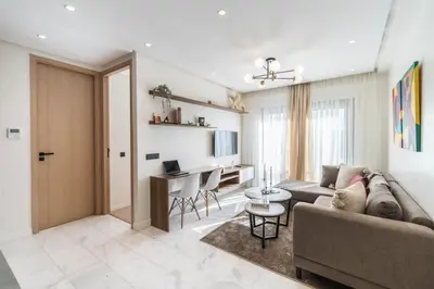 a living room with a couch and a table at Studio palmier TR3 in Casablanca