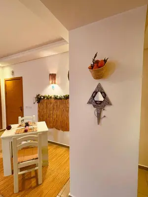 a room with a table and a basket of fruit on a wall at Havre de Paix in Casablanca in Casablanca