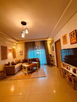 a large living room with a couch and a tv at Havre de Paix in Casablanca in Casablanca