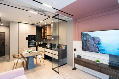 a living room with a large flat screen tv on a wall at El home del belbala in Casablanca