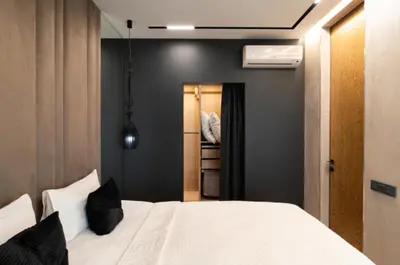 a bedroom with a white bed and a closet at El home del belbala in Casablanca