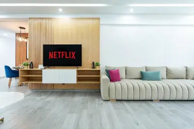 a living room with a couch and a tv at Luxury cozy apartment in Casablanca
