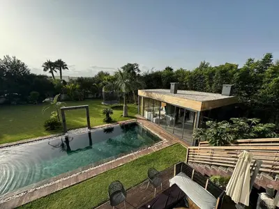 an aerial view of a house with a swimming pool at 1700sqm Unique Villa in Bouskoura in Bouskoura