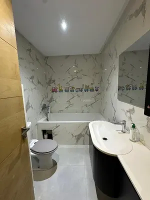 a bathroom with a toilet and a sink and a tub at 1700sqm Unique Villa in Bouskoura in Bouskoura