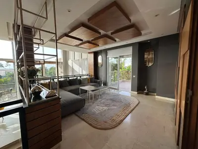a living room with a couch and a table at 1700sqm Unique Villa in Bouskoura in Bouskoura