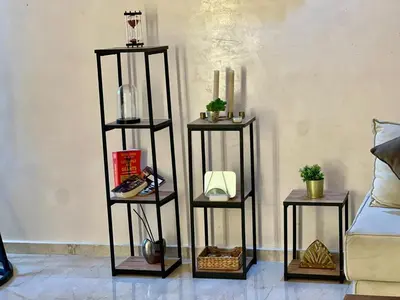 two shelves in a living room with two tables at Apartment Casa Marina - Borgone, Ocean & Hassan II Views in Casablanca