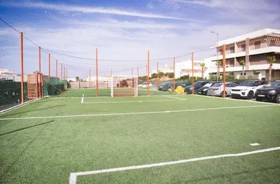 a soccer field with a net on a parking lot at KST Home-Heaven Beach Sidi Rahal in Sidi Rahal