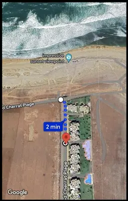 a map of a beach with the ocean at Appartement de luxe vue sur mer in Bouznika