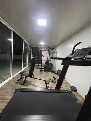 a gym with tread machines and a treadmill at A102 Studio cosy & chic in Casablanca