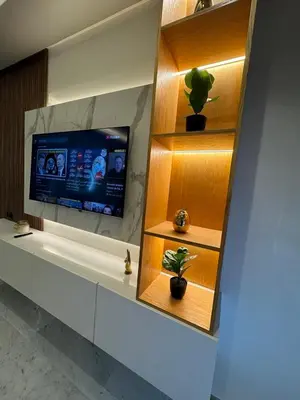 a room with a tv and a plant on a shelf at Stay Bright with Hometa in Casablanca