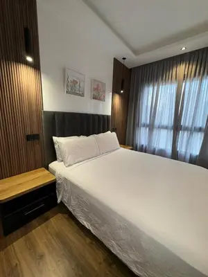 a bedroom with a large white bed and a window at Stay Bright with Hometa in Casablanca