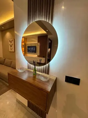 a living room with a circular mirror on the wall at Stay Bright with Hometa in Casablanca