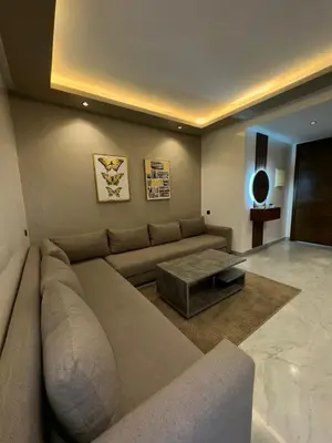 a living room with a large couch and a table at Stay Bright with Hometa in Casablanca