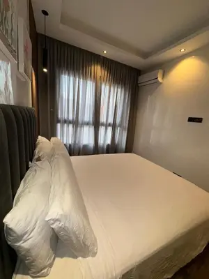 a large white bed in a room with a window at Stay Bright with Hometa in Casablanca