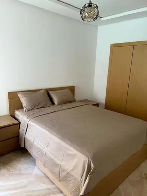 a bedroom with a large bed in a room at Kettani Shems Bouznika in Bouznika