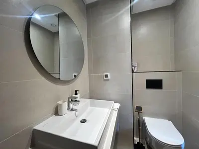 a bathroom with a sink and a mirror and a toilet at Small Cozy Nest in Quiet Area - Central with Balcony in Casablanca