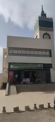 a building with a clock tower on top of it at yakout in Mohammedia