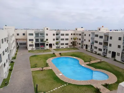 an aerial view of an apartment complex with a swimming pool at Vakantie app charmante Harhoura in Temara