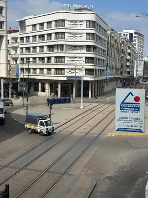 a truck is parked in front of a building at Cosy 2BR in Heart of Casablanca in Casablanca