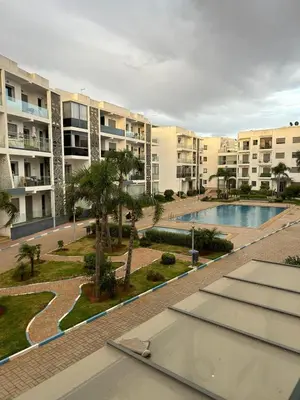 a view of an apartment complex with a swimming pool at Maison à louer à Mohammedia in Mohammedia