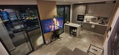 an aerial view of a kitchen with a large screen television at Maârif Penthouse in Casablanca
