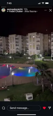 a screenshot of a picture of a swimming pool at night at Beautiful 2 bedrooms apartment in Bouznika in Bouznika