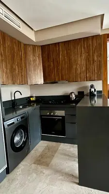a kitchen with a washing machine and a dishwasher at The Hidden Secret in Casablanca