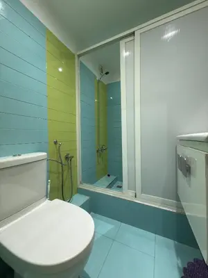 a bathroom with a toilet and a shower at Appartement au centre ville pour les mariés seulement in Rabat
