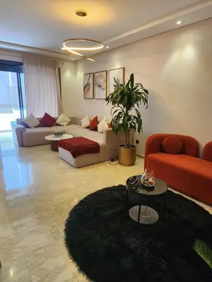 a living room with a couch and a table at Seaside, Infinity Pools, Gym, Games, Wifi in Tamaris