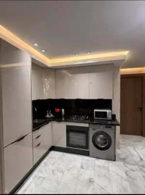 a kitchen with a stove and a microwave at Stay luxe in Casablanca