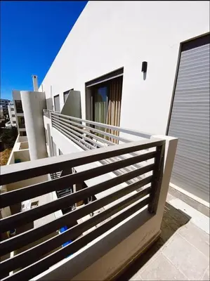 a balcony of a white building with a railing at Concept Studio-valfleuri in Casablanca