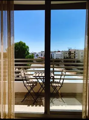 a balcony with a table and chairs on a roof at Concept Studio-valfleuri in Casablanca