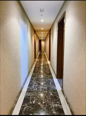 a hallway of a building with a marble floor at Concept Studio-valfleuri in Casablanca