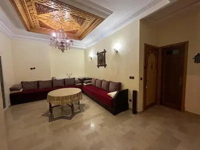 a living room with a couch and a table at Casa Amy in Mohammedia