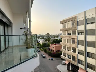 an apartment balcony with a view of a city at Rihla Stays - Anfa City in Casablanca