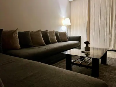 a living room with a couch and a coffee table at Rihla Stays - Anfa City in Casablanca